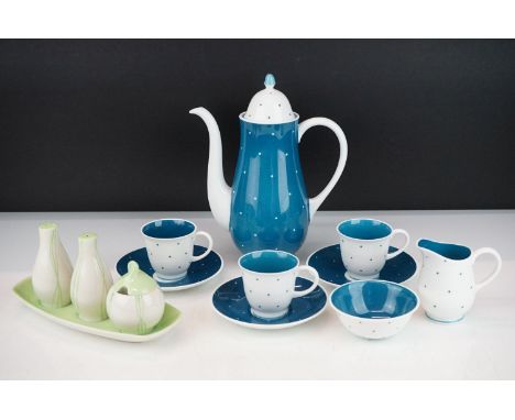 Susie Cooper coffee set having a white ground blue polka dot pattern, consisting of coffee pot, creamer jug, sugar bowl and t