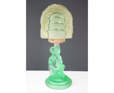 Art Deco 1930s pressed green glass lamp base in the form of a crouching female figure having an arched green glass shade to t