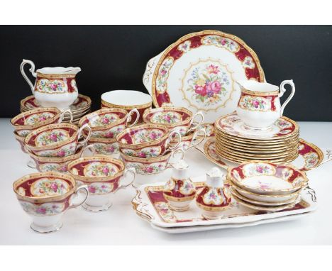 Royal Albert Lady Hamilton tea service consisting of 12 tea cups, 11 saucers, two creamer jugs, salt and pepper shakers, suga