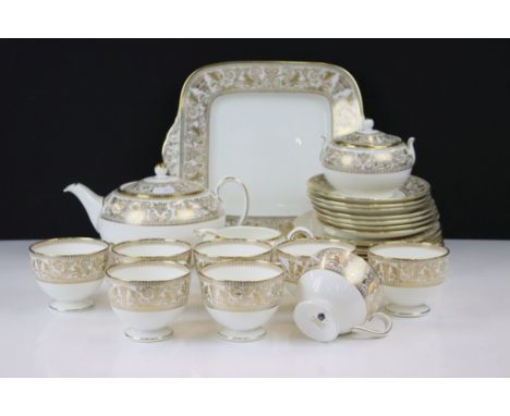 Wedgwood Gold Florentine tea service having a white ground with gilt classical detailing. The lot to include teapot, eight cu