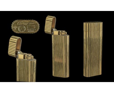 Cartier - Paris Deluxe Gold Plated Lighter, of Ribbed Design. Ref No 48928. 2.3/4 Inches - 6.90 cms High. Good Overall Condit