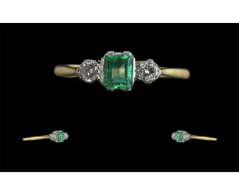 18ct Gold and Platinum Superb and Exquisite Three Stone Emerald and Diamond Set Ring, marked 18ct and platinum; the step cut 