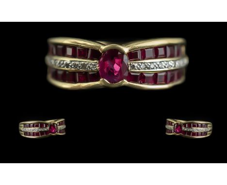 Ladies 18ct Gold Modern Ruby &amp; Diamond Set Ring, marked 750 - 18ct to interior of shank.  The step-cut rubies of good col