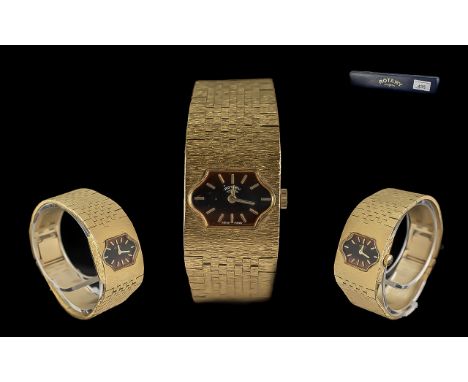 Ladies Manual Wind Rotary Watch, gold tone bracelet strap, black and amber face with gold baton numerals, working at time of 