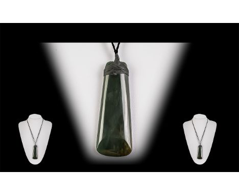 Large Deep Jade Pendant, suspended on a leather plaited cord.  Pendant measures 3.5" long. 