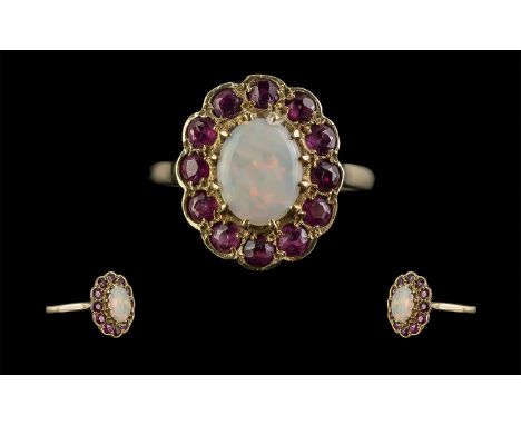 Ladies 9ct Gold Attractive Garnet and Opal Set Cluster Ring, Full Hallmark to Shank. The Central Opal of Excellent Colour Sur