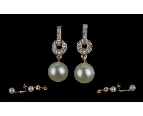 Pair of 9ct Rose Gold Diamond and Pearl Drop Earrings. Diamond weight 0.16 ct.  Pearls suspended on a diamond set bale.