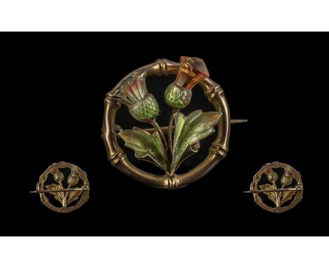 Antique Period - Scottish 9ct Gold and Enamel Thistle Brooch of Circular Form. Marked 9ct. Weight 3.1 grams. (One stone missi