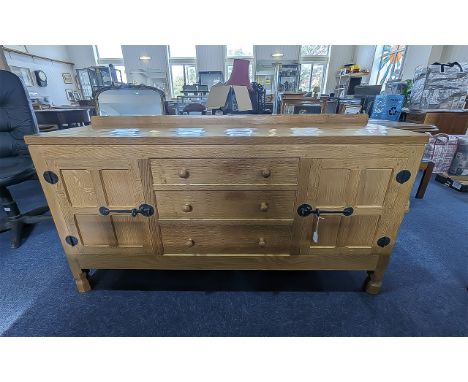 Robert 'Mouseman' Thompson Sideboard.  A Robert Mouseman Thompson of Kilburn oak sideboard, with three central drawers flanke