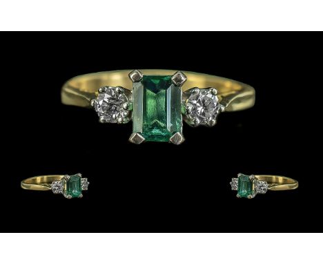 18ct Gold - Attractive 3 Stone Emerald and Diamond Set Ring. Marked 750 - 18ct. The Central Emerald Flanked by Two Diamonds, 