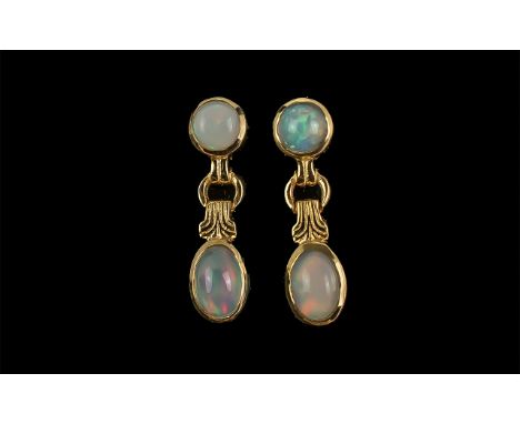 Opal Drop Earrings, comprising cabochon cut opals with strong flashes of colour, the single drops set below round cuts in yel