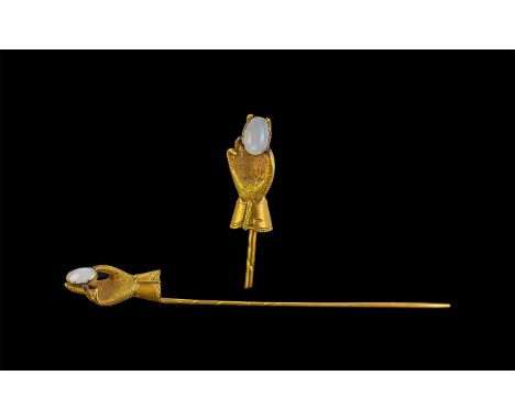 15ct Gold Stick Pin, formed as a hand holding an opal.  In original box.