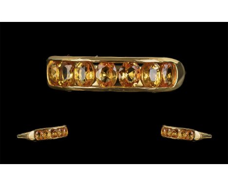 Yellow Sapphire Half Eternity Ring, a row of wonderful, oval cut yellow sapphires, channel set in an 18ct gold vermeil and si