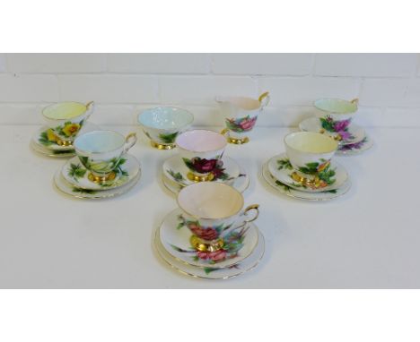 A Paragon china tea set in the 'Rendezvous' pattern, painted with six world famous roses by 'Harry Wheatcroft' comprising six