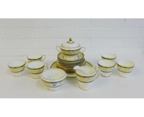 A Minton 'Aragon' patterned china teaset, comprising six cups, six saucers, six side plates, a cake plate, a milk jug, sugar 