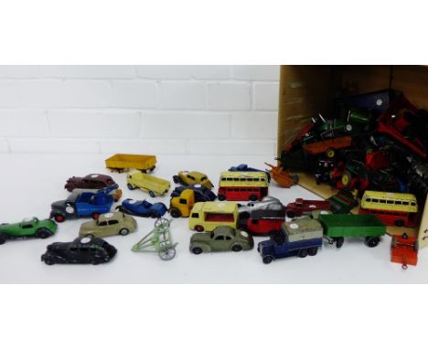 A carton containing a quantity of vintage, mainly Dinky cars to include a Lincoln Zephyr, Bedford trucks and a Massey Harris 