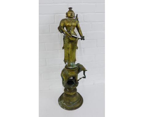 South Indian cast brass oil lamp modelled as Dipa- Lakshmi  with circular base, 77cm high
