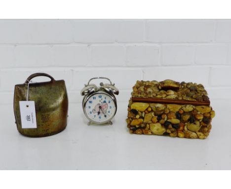 A mixed lot to include a shell box, a vintage cow bell and a Mr. Lazy clock, (3) 