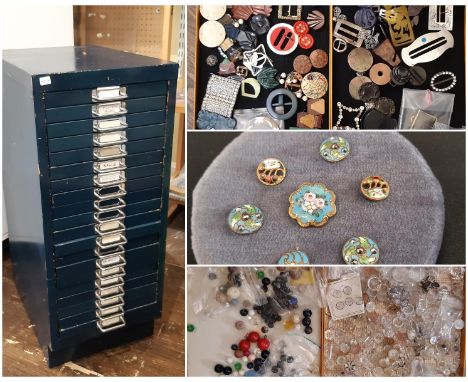 A large collection of 19th - 20th century decorative buckles and buttons housed in a 20-drawer metal cabinet in various mater