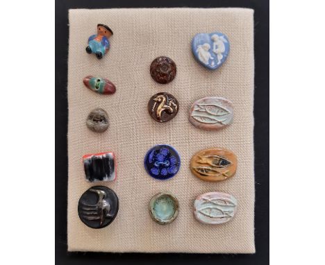 A small collection of unmarked ceramic buttons including a green glazed round button 25mm possibly by Lucie Rie and a glazed 