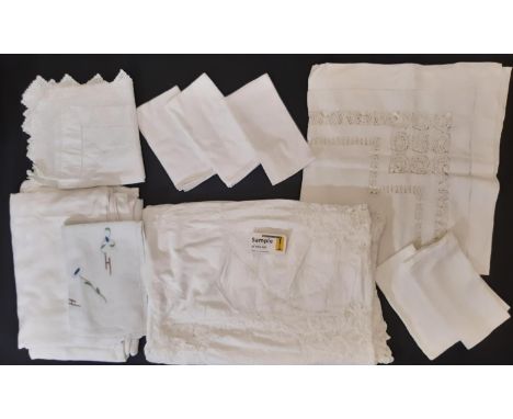 A quantity of white table linen comprising 4 damask tablecloths, napkins, vintage cloths with embroidery and pulled thread wo
