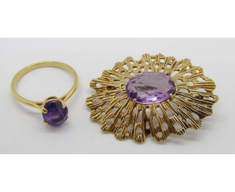 1960s 9ct amethyst brooch with pierced frame, 7.1g and a yellow metal amethyst solitaire ring size O, 2.3g (2) 