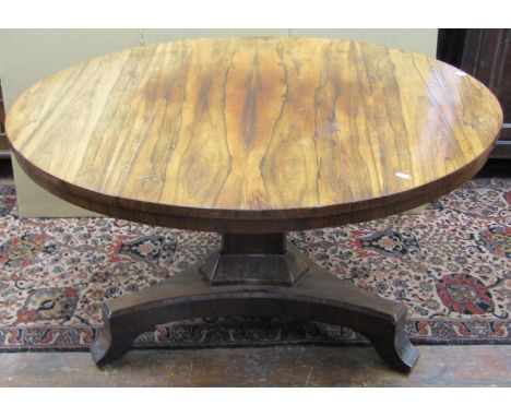 A Regency rosewood centre table, the circular top raised on a tricorn pillar and base, 135cm diameter 