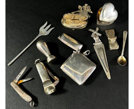 A collection of silver trinkets, etc including caddy spoons, a vesta, a locket, a silver purse, a page marker, medallions, ci