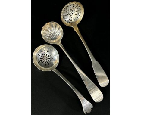 A Scottish William IV silver sugar casting spoon, Edinburgh 1827, maker William Marshall, together with two others 2.5 ozs ap