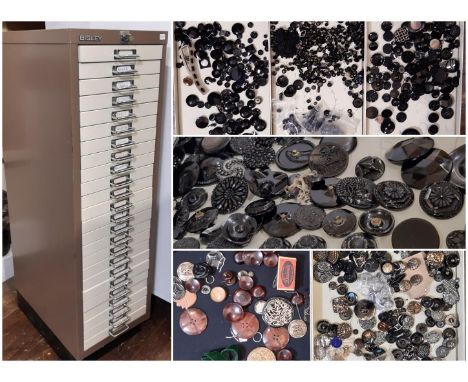 A substantial collection of decorative19th - 20th century buttons housed in a 24-drawer lockable metal cabinet, most sorted b