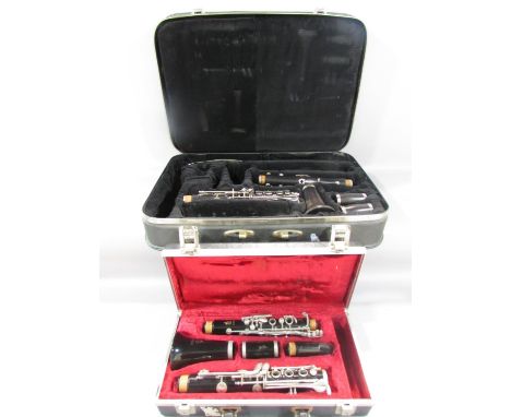 A Boosey &amp; Hawkes Regent Clarinet in a hard case, and a Boosey &amp; Hawkes Emperor clarinet in a hard case. 
