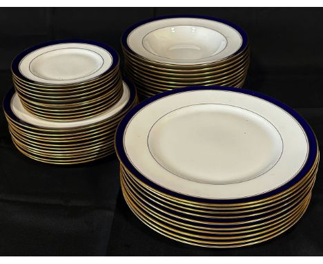 A collection of Royal Worcester Howard pattern dinner ware comprising eleven dinner plates, eleven side plates, soup plates, 