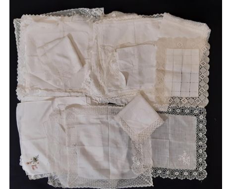 A collection of vintage ladies' handkerchiefs, mostly of fine cotton lawn with various styles of lace trim, in excess of 50 