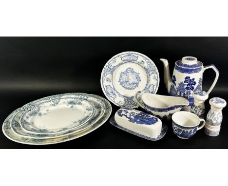 A collection of blue and white china including Willow pattern and meat plates, cups saucers, plates, etc 