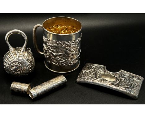 A mixed collection of 19th century silver including a small tankard, a tobacco box, a snuff box, needle case, money clip, pra