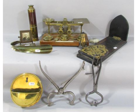 Two pairs of Georgian steel sugar nips, a pair of Victorian postal scales with a selection of weights, a Victorian book slide