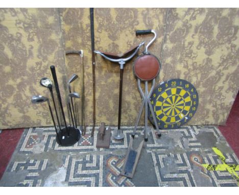 A shooting stick, golf club, riding crop, golf club stand, dart board, snooker cloth iron 