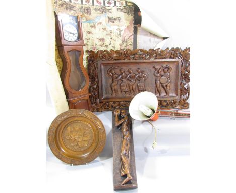 A carved wooden panel with six folk dancers signed 'D. Jankov Ohrid', a small wooden longcase clock, the arm of an orange spr