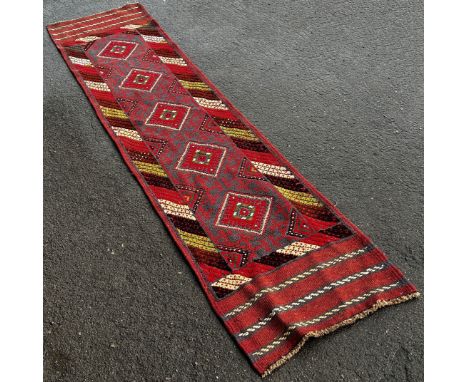 Meshwani Runner with repeating red and blue diamond pattern with hints of mint green,  241cm x 62cm 