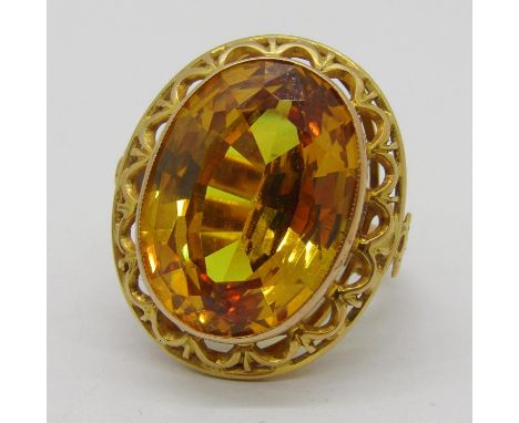 Vintage synthetic yellow sapphire cocktail ring, the oval sapphire measuring 1.9 x 1.4cm approx, gold marks worn, size L, 9.7