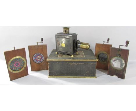 A 19th century German 'Laterna Magica', candle lit slide projector with it’s original box and a selection of twelve colour sl