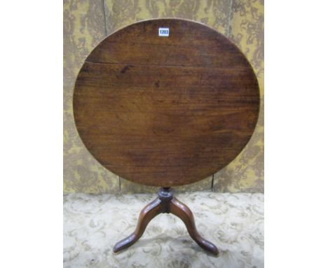 A Georgian mahogany snap-top occasional table with circular top raised on a vase shaped pillar and swept tripod, 70cm high, 7