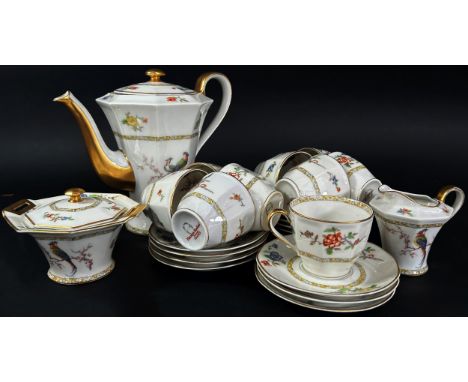 A Limoges porcelain coffee set decorated with exotic pheasants - 9 cups &amp; 12 saucers, coffee pot, sugar &amp; cream 