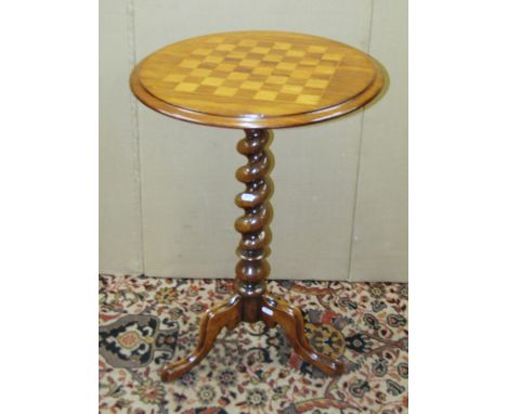A 19th century rosewood chess table raised tapered barley twist column and a tripod base, 47cm diameter x 71cm high 