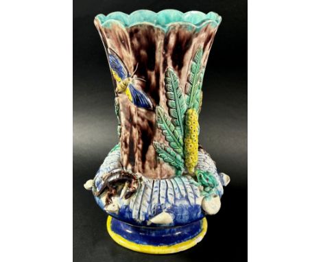 A late 19th century majolica vase, the fluted neck set within a circular ring encrusted with lizards, frogs, moths, seashells
