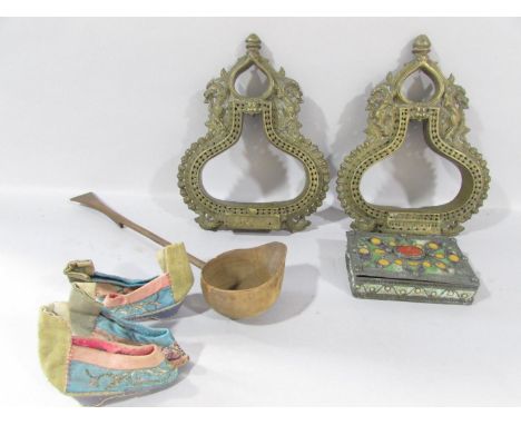 A pair of Chinese Ceremonial Brass Stirrups, two pairs of miniature silk Chinese shoes, a wooden ladle and an enamel trinket 
