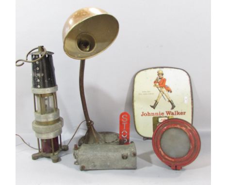 A vintage flexi desk lamp, a miner’s Spiralarm gas warning device, a Jonnie Walker Whisky Advertisement wall calendar and a S