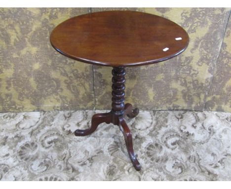 A Victorian mahogany snap top occasional table of oval form raised on a bobbin turned pillar and shaped tripod, 67 cm high x 