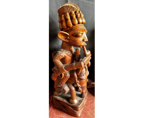 Akinlabi (Akin) Fakeye (Nigerian, Yoruba b.1936) A good associated pair of figure carvings, one an Oba presented on horseback