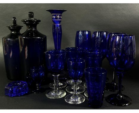 A collection of Bristol Blue Glassware, including four wine glasses, eight medium size wine glasses, a candlestick, two chemi